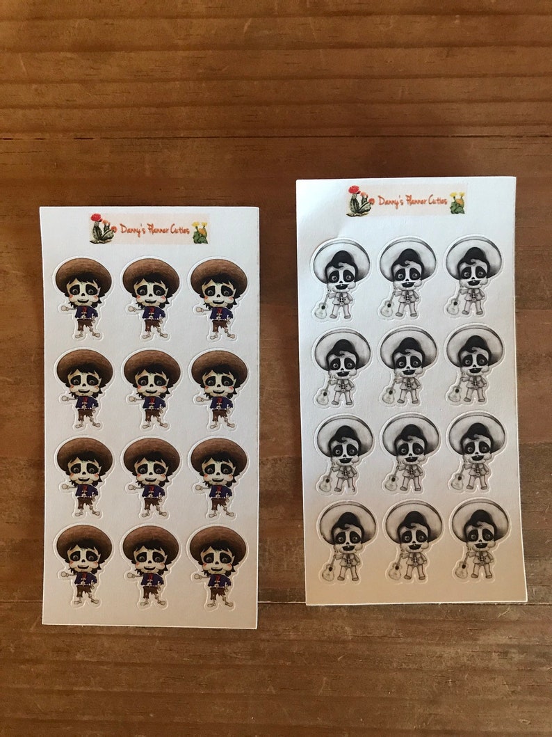 May include: Two sheets of stickers featuring cartoon characters. One sheet has characters with brown hats and outfits, the other has characters with sombreros and guitars. The stickers are on a white background with the text "Danny's Planner Cuties".