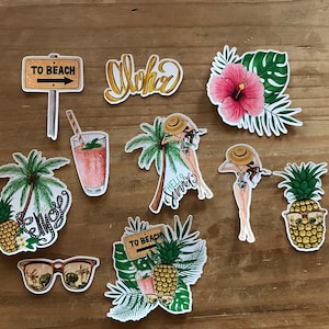 May include: A set of ten colorful stickers with a tropical theme. The stickers feature pineapples, palm trees, a cocktail, a sign that says "To Beach", a woman in a bikini, and the word "Aloha".