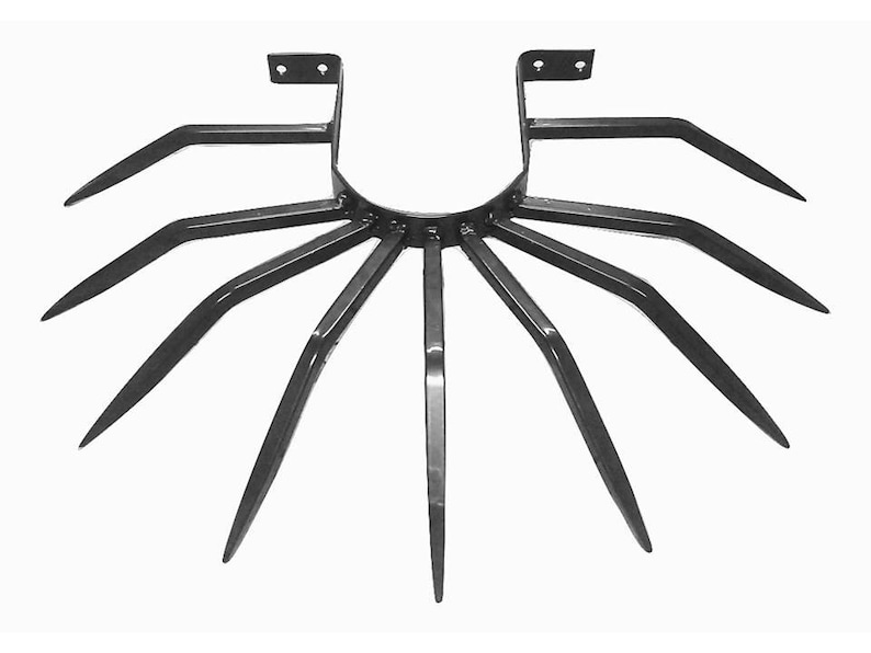 May include: Black metal garden tool with multiple tines, designed for aerating soil. The tool has a circular base and two upright supports.