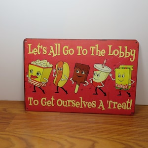 P 13 Tin Sign Vintage Let's All Go To The Lobby Theater Sign New Old Stock 12" X 8"