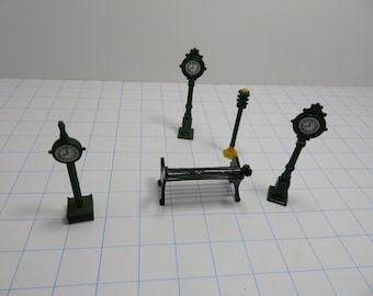 T 559 Vintage HO & O Gauge Scale Solid Metal 1980 (3) Town Clocks, (1) Park Bench, (1) Light - All Metal Mint Condition Brand New Old Stock