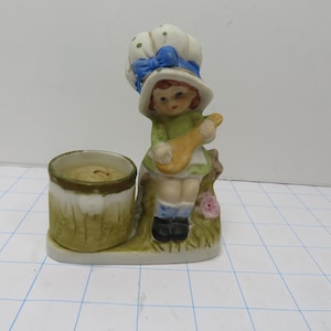 MH 602  Hand Painted Porcelain Girl By Luvkind With Candle 1979 Vintage