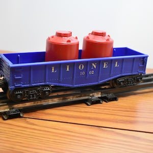 T 569 O-O/27 Lionel 1960 Gondola 1002 With Load Well Weighted & Metal Wheels Nice Shape