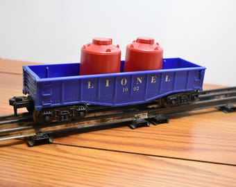 T 569 O-O/27 Lionel 1960 Gondola 1002 With Load Well Weighted & Metal Wheels Nice Shape