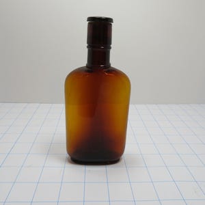 P 532 Vintage Manufacturing  Bottle Company Amber 1950&#39;s Bottle Chemical Or Medicine Type Bottle (Has Small Chip In Stopper) Great Condition