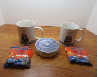 T 360 Lionel Vintage Mugs (2) & Includes Cookie Tin, (2) Bags Of Cocoa New Old Stock
