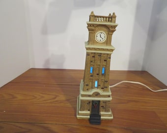 F 337 Vintage Holiday Time Village 2004 porcelain Lighted Clock Tower Hand Painted - No Chips Or Cracks - Excellent Condition