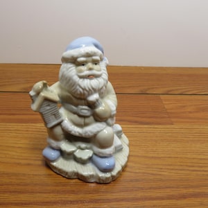 T 670 Vintage 1990 Nobel Hall Porcelain Santa Holding A Home - Soft Blue Glaze No Chips Or Cracks