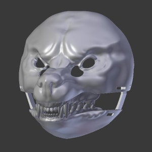 Op de afbeelding: Een grijs 3D-model van een wolf- of hondenmasker met een gedetailleerde snuit en tanden. Het masker is ontworpen om te worden gedragen en heeft een band aan de achterkant.
