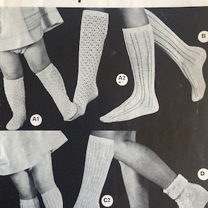 May include: A vintage knitting pattern for knee and ankle socks. The pattern is called "Lyscordet" and is from Twilley's. The pattern includes four different styles of socks, labelled A, B, C, and D. The pattern is for 12 sizes.