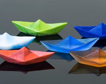 Paper boat in Murano glass. Realistic realization in glass.Sculpture of the glass master. Paper boat imitation. Paperweight glass made.