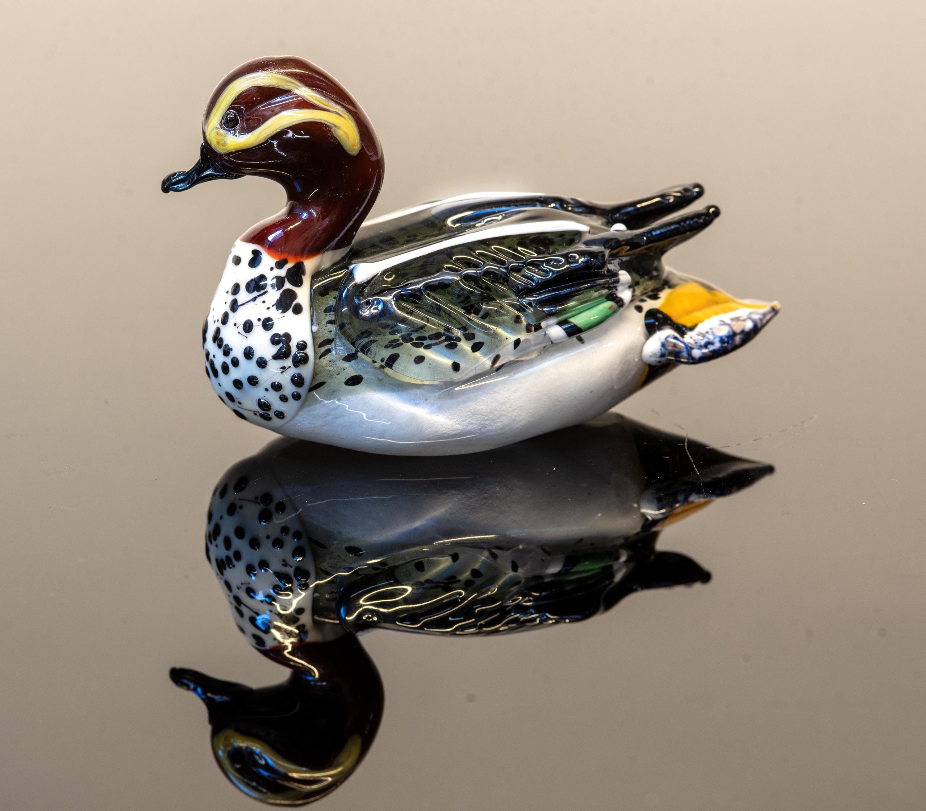 Duck in Murano glass. Realistic realization in glass multicoloured.Sculpture of the glass master.