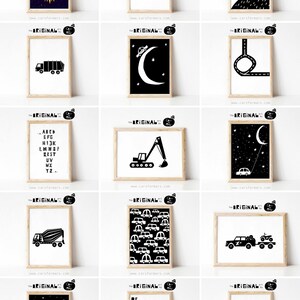 May include: A set of 12 black and white printable wall art prints featuring various illustrations of vehicles, animals, and words. The prints are framed in a light wood frame.