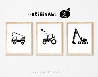 May include: Three framed black and white art prints featuring construction vehicles. The prints include a crane truck, a tractor, and an excavator. The text "The Original art by Cars for Mars" is above the prints. The website address "carsformars.com" is at the bottom.