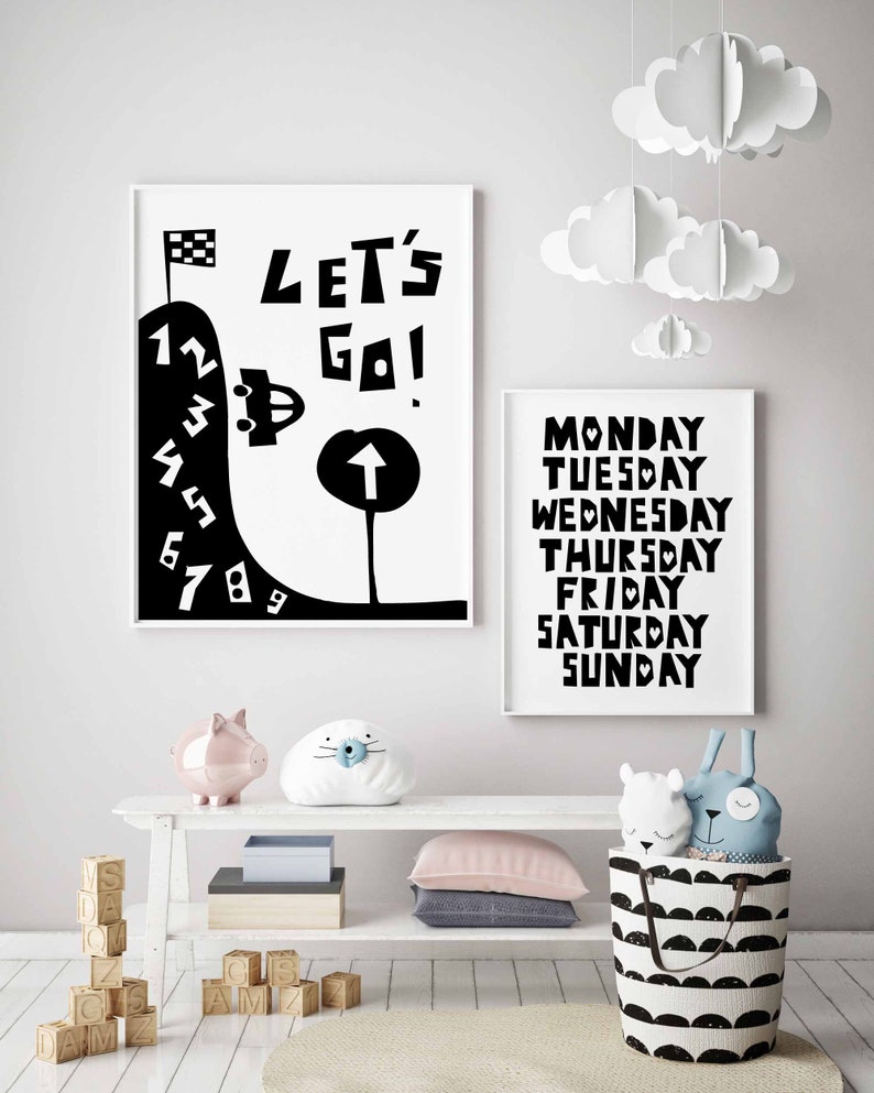 May include: Black and white illustration of a car driving up a hill with numbers 1 through 9. The text "LET'S GO!" is above the car. A second black and white illustration shows the days of the week, Monday through Sunday.