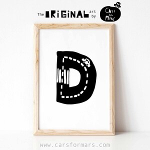 May include: Black and white printable art print of the letter D shaped like a road with a car driving on it. The text "The ORIGINAL art by Cars for Mars" is at the top of the print.