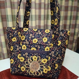 quilted 2 strap shoulder purse with 11 pockets makeup pouch included emb.sunflower design on front pocket