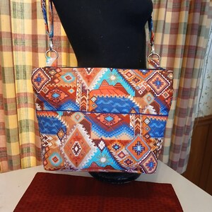 Quilted cross 58 in adjustable southwestern print print is called (Spirit Trail ) 11 pockets makeup pouch included