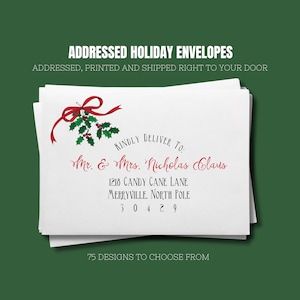 May include: A white envelope with a red bow and holly design. The envelope is addressed to Mr. & Mrs. Nicholas Claus, 1218 Candy Cane Lane, Merryville, North Pole 30429. The text "Kindly Deliver To." is printed above the address.