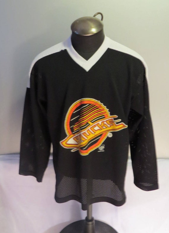 canucks skate logo jersey