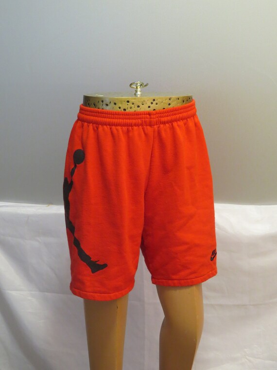black and orange jordan shorts