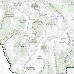 May include: A detailed map of a mountainous region, with names of mountain ranges, cities, and rivers. The map uses a neutral colour palette with brown, grey, and green tones, and includes the Continental Divide Trail.
