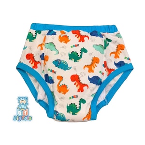 May include: White training pants featuring a colourful dinosaur pattern. The dinosaurs are in shades of orange, red, green, and blue. The pants have blue trim around the edges and waist. The text "RAR!!" is printed on the pants.