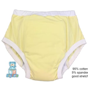 Peut inclure: Sous-vêtements jaunes avec bordure blanche. Le vêtement est composé de 95% de coton et 5% d'élasthanne, offrant une bonne extensibilité. Le logo Big Tots est visible en bas à gauche. Texte : 95% coton, 5% élasthanne, bonne extensibilité.