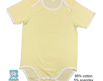 May include: A light yellow baby bodysuit with short sleeves and white trim. The bodysuit is made of 95% cotton and 5% spandex, with a good stretch. The text "Big Tots" is visible on the lower left corner.