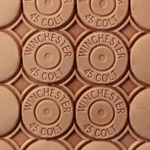 Tools for leather crafts. Stamp #457 Winchester 45 colt