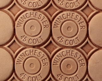May include: Close-up of a pattern of brown leather rounds with the words "Winchester" and "45 Colt" embossed on each round.
