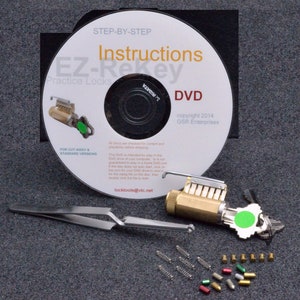 May include: A DVD labeled "EZ-Rekey Practice Locks" with instructions for lock picking. The DVD is accompanied by a lock, a key, tweezers, and a variety of lock picking tools.