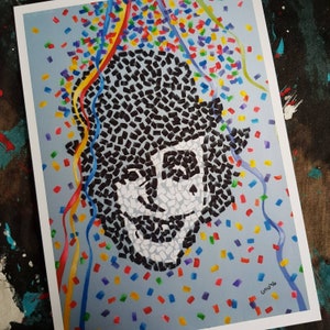 May include: A black and white mosaic portrait of a person with a smile, surrounded by colorful confetti on a blue background.