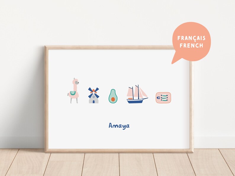 May include: A framed print with a white background and colorful illustrations of a llama, windmill, avocado, sailboat, and a box of fish. The text "Amaya" is printed below the illustrations. The text "FRAN&Ccedil;AIS FRENCH" is printed in a speech bubble in the top right corner.