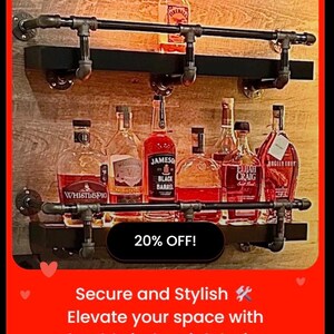 May include: Industrial-style liquor shelf with black metal pipes and wooden shelves. The shelf holds various liquor bottles, including Jameson Black Barrel and Elijah Craig. The image includes the text "20% OFF!" and "Secure and Stylish. Elevate your space with durable industrial design."