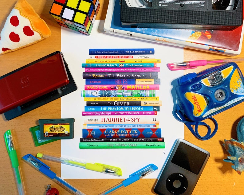 May include: A stack of popular children's books on a wooden table with a red Nintendo DS, a green Game Boy Advance, a blue and yellow disposable camera, a black and white Rubik's cube, a pizza slice, a white iPod, and two pink and blue pens.