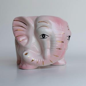 Pink ceramic elephant planter with gold accents