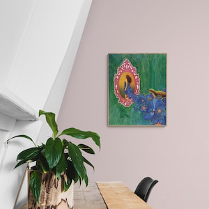 May include: A framed painting of a woman in a blue dress standing in a pink ornate mirror with blue flowers on a green background.