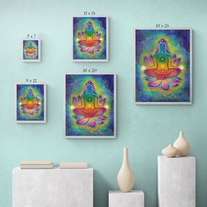 May include: A colorful illustration of a person meditating in a lotus position with seven chakras represented by different colors. The background is a galaxy-like pattern with stars and swirls. The image is available in various sizes, including 5x7 inches, 9x12 inches, 11x14 inches, 16x20 inches, and 18x24 inches.