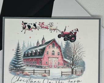 May include: A Christmas card depicting a red barn with a white roof and a snowy scene. The text "Christmas On The Farm" is displayed at the bottom of the card. A red tractor with a Santa Claus figure is pulling a string of farm animals, including a pig, a cow, and a goat.