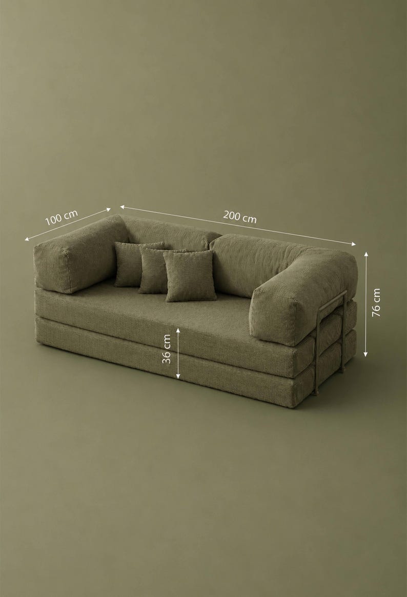 May include: Olive green modular sofa with three matching throw pillows. The sofa is 200 cm long, 100 cm wide, and 76 cm high. The seat height is 36 cm. The sofa has a corduroy texture and a metal frame.