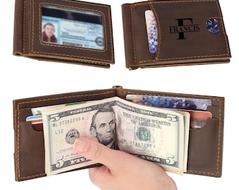 May include: A brown leather money clip wallet featuring a clear ID window, multiple card slots, and a metal clip for holding paper currency. The exterior is embossed with the name FRANCIS and a large letter F. The wallet is shown open and closed.