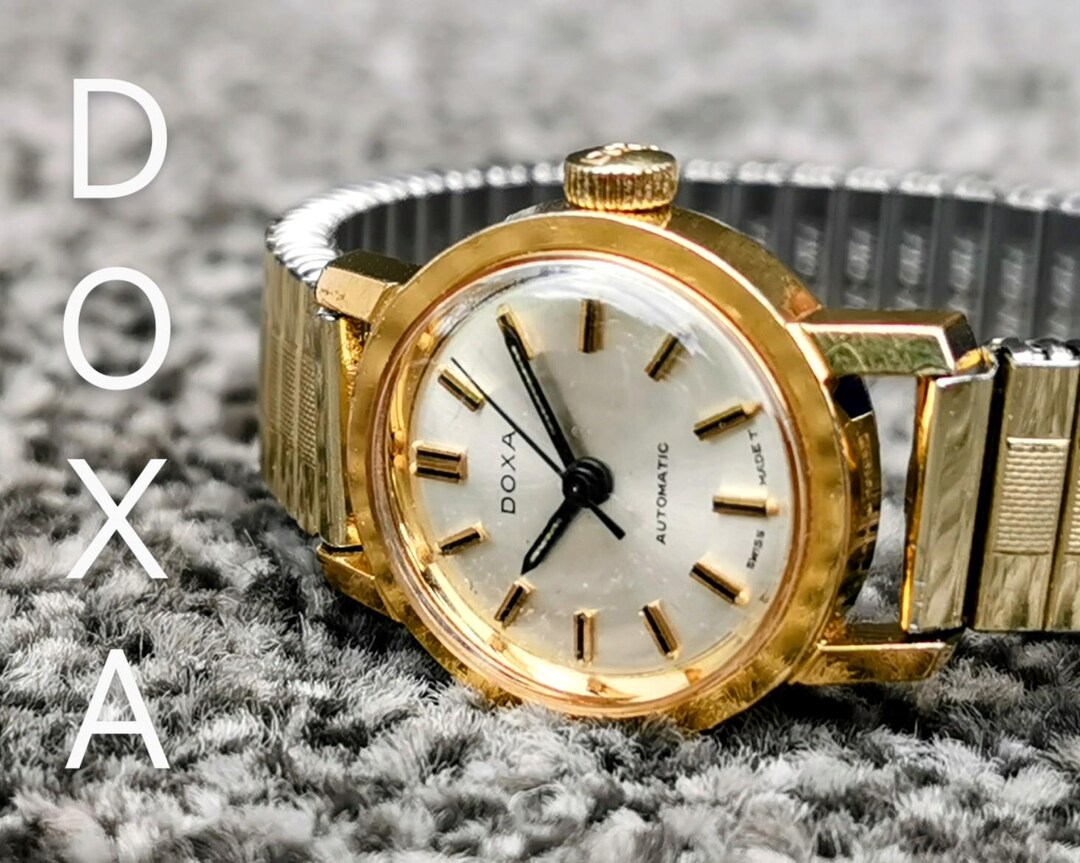 DOXA 手巻き腕時計 スイス製 ビンテージ シルバー ラウンドフェイス ヴィンテージ DOXA スイス製自動巻き腕時計、ラウンド型シルバー文字盤