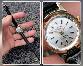 Montine horloge uit de jaren 70, Zwitserse makelij, 17 juwelen, ronde wijzerplaat, gefacetteerd kristal, vergulde ring, leren band