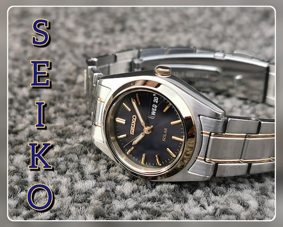 Seiko SOLAR Watch, Blue Dial, Lumi Hands, E/F Day Date, Stainless Steel Bracelet