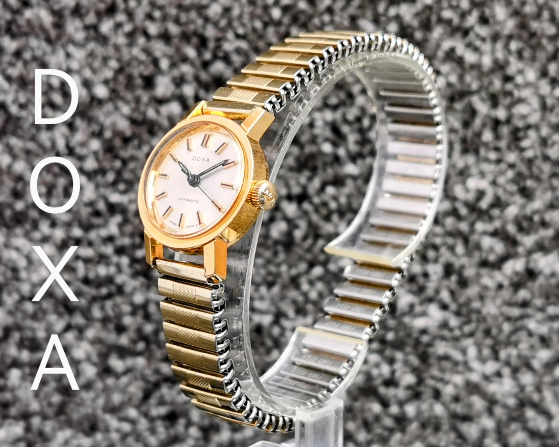 DOXA 手巻き腕時計 スイス製 ビンテージ シルバー ラウンドフェイス ヴィンテージ DOXA スイス製自動巻き腕時計、ラウンド型シルバー文字盤