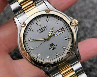 Vintage Seiko SQ150 Quartz Watch: Two-Tone Bracelet, Arabic Date, 1990s Style