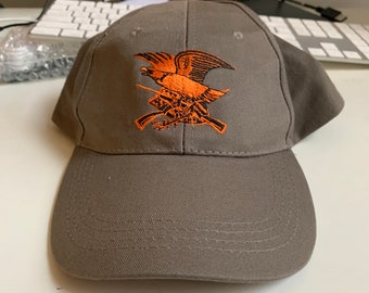 NRA Hat Beige Eagle with Guns Orange Embroidery