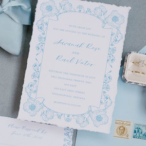 May include: A wedding invitation with blue floral designs and text that reads "With great joy you are invited to the wedding of Savannah Rose and Raul Victor Saturday the thirtieth of July two thousand twenty-two 600 East 600 East Ohio Street Indianapolis, Indiana Reception to follow Please Respond by June 30th 2022 Names Accepts Declines Initial by food choice for each guest Chicken Vegetarian"