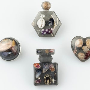 Shimmering black beach brooches, made from Shetland Island beach  treasures, Scotland. Resin jewellery at its finest.